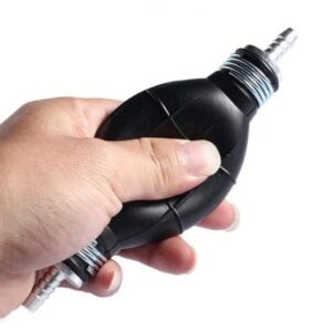 Fuel Primer bulb squeezed by a hand